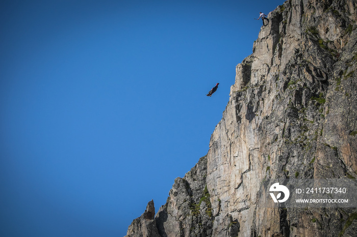 a wingsuit jumper jumping from a cliff in Brevent, Auvergne-Rhône-Alpes, Chamonix, France