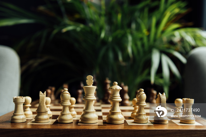 Closeup view of chess set on chess board. Selective focus on white chess figures