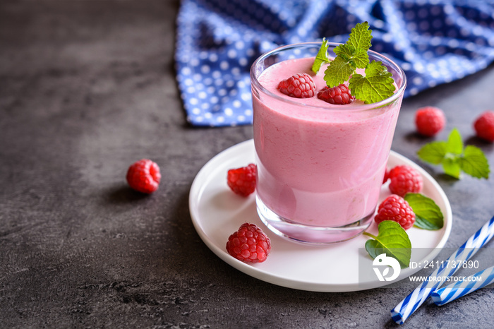 Glass of refreshing raspberry milkshake for breakfast