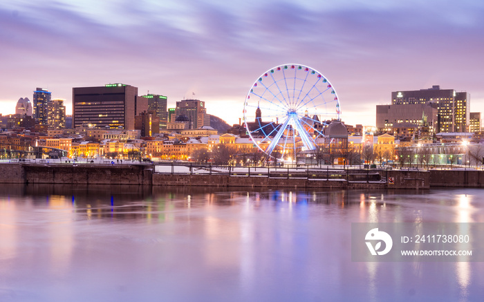 Sunset in winter over Montreal old port and ferris wheel in Quebec (Canada)