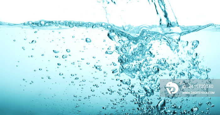 Close up blue Water splash with bubbles on white background