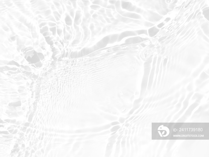 Defocus blurred transparent white colored clear calm water surface texture with splashes and bubbles. Trendy abstract nature background. Water waves in sunlight with copy space. White water shinning