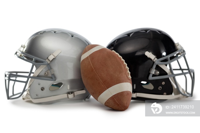 Close up of American football with helmets