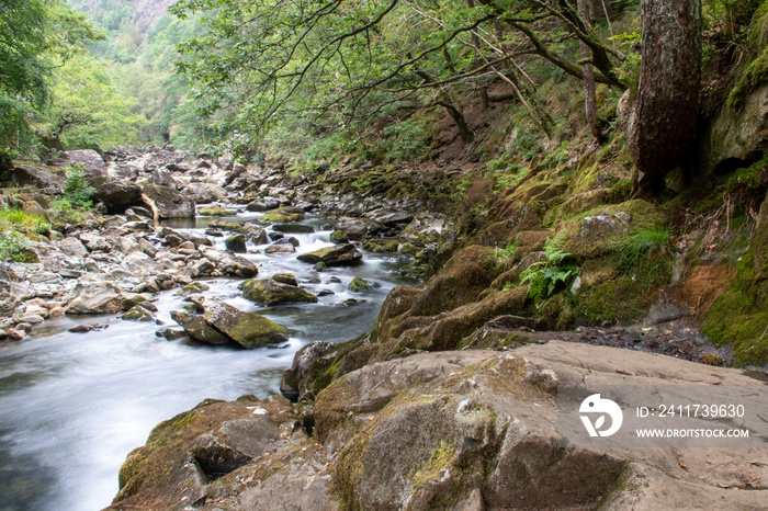 Fast flowing water/waterfalls flowing through the Aberglaslyn Pass near to Beddgelert, in Snowdonia National Park, north Wales