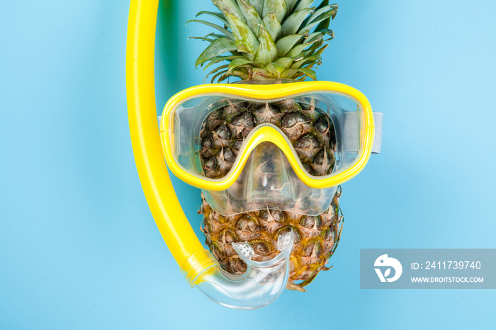 Pineapple in a snorkeling mask