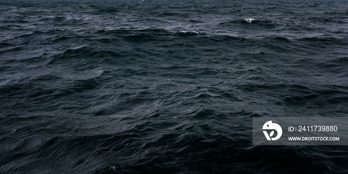 Dark and blue sea water surface