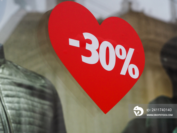 Discount 30% on the background of the heart