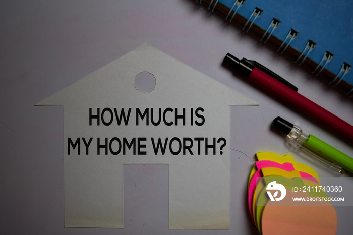 How Much is My Home Worth? on sticky Notes isolated on office desk.