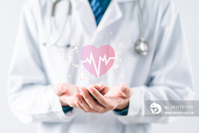 Doctor in white coat holding heartbeat icon for positive healthcare insurance symbol concept, Mental health care, medical check up, heart attack, cardiology, help from specialist concept.