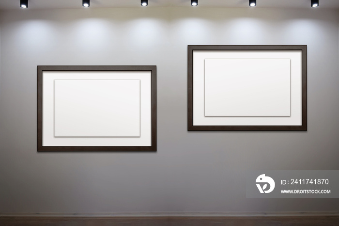 Wall art template  - Illuminated empty wall with two blank picture frames with copy space for your artwork visualisation.