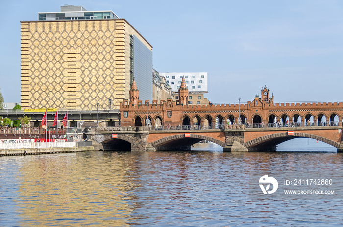 Banks of the river Spree with a part of the Oberbaum Bridge and the building of Eierkuehlhaus in Berlin