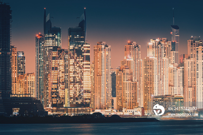 Night cityscape view of various skyscrapers. Real Estate and residential building concept