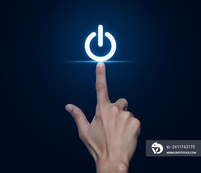 Hand pressing power button icon over blue background, Start up business concept