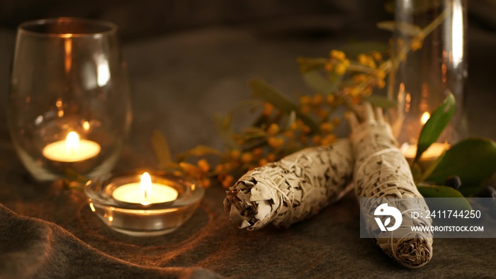 Dried white sage smudge stick, relaxation and aromatherapy. Smudging during psychic occult ceremony, herbal healing, yoga or aura cleaning. Essential incense for esoteric rituals and fortune telling