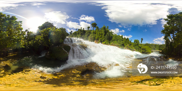 Cascade of Aliwagwag Falls in green forest, aerial drone. Waterfall in the tropical mountain jungle. Philippines, Mindanao. 360 panorama VR.