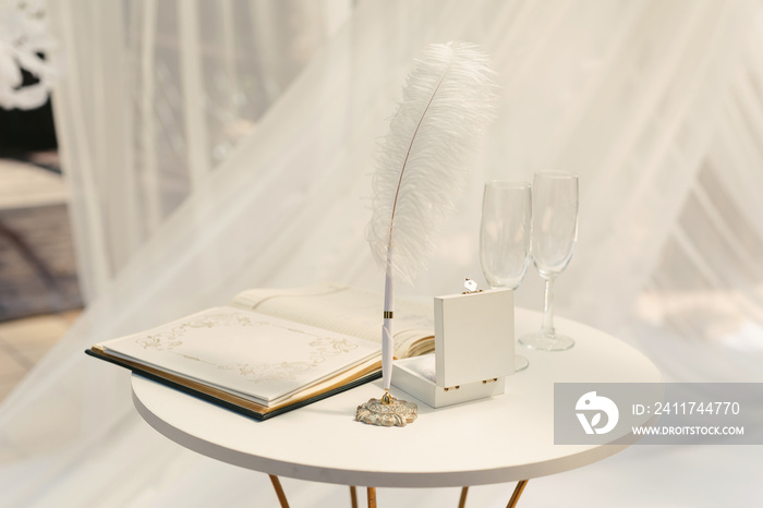 Champagne glasses on the table for registration at the wedding ceremony.