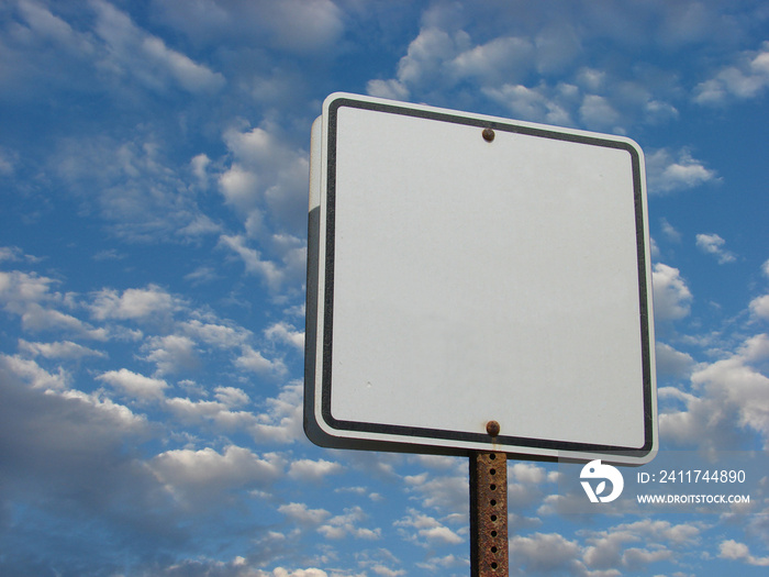 Blank white sign with cloudy sky