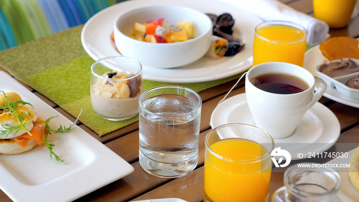 Served breakfast food in hotel restaurant. Buffet service. Tasty morning food in luxury modern resort. Fresh croissant, orange juice and english tea on cafe table.