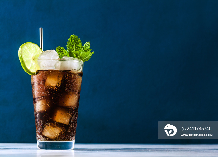 Coca Coke cocktail in a tall glass cuba libre. refreshing summer drink