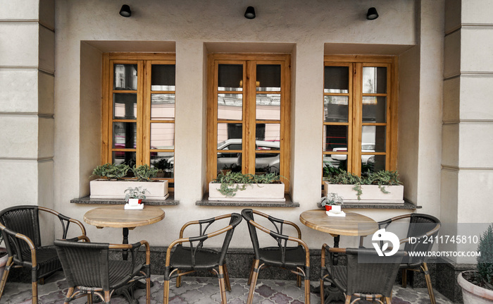 Tables and chairs of city street cafe