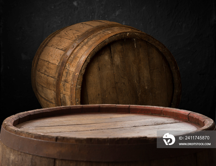 Old wooden barrel on a brown background