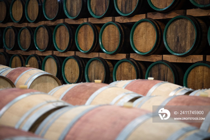 Wooden wine barrels for storage in wine cellar