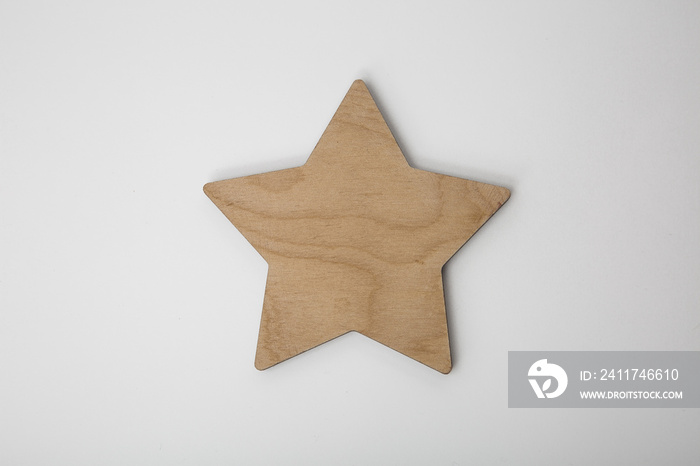 Wooden christmas star ornament on white