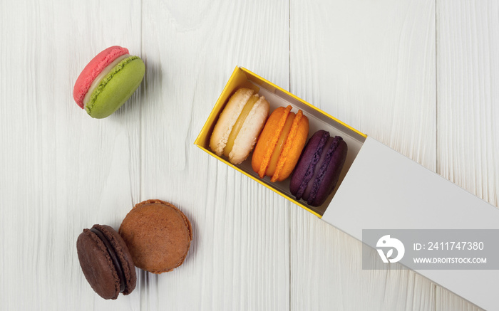 Plain French macarons box on wooden table