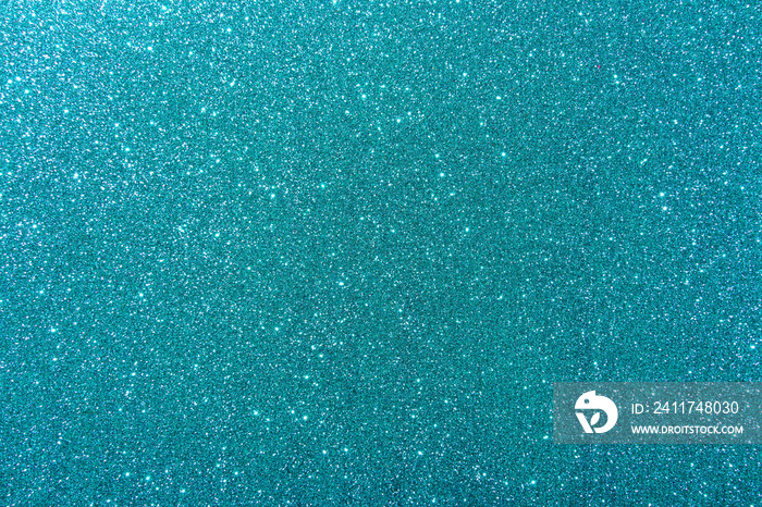 Background with sparkles. Backdrop with glitter. Shiny textured surface. Dark cyan