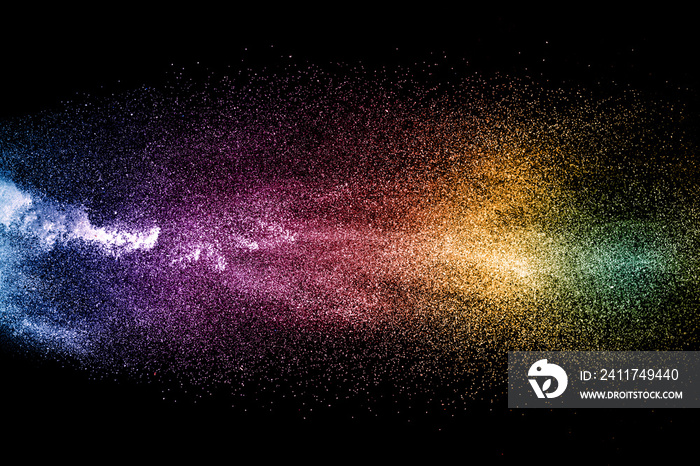 abstract colored dust explosion on a black background.abstract powder splatted background,Freeze motion of color powder exploding/throwing color powder, multicolored glitter texture.