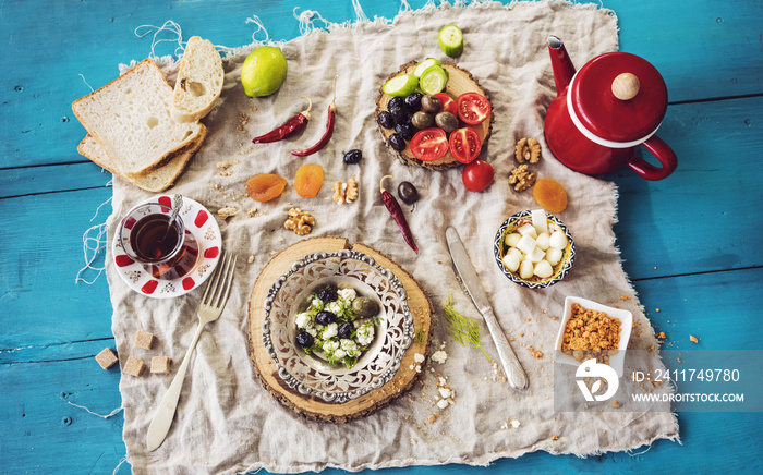 Delicious traditional turkish breakfast on blue wooden table