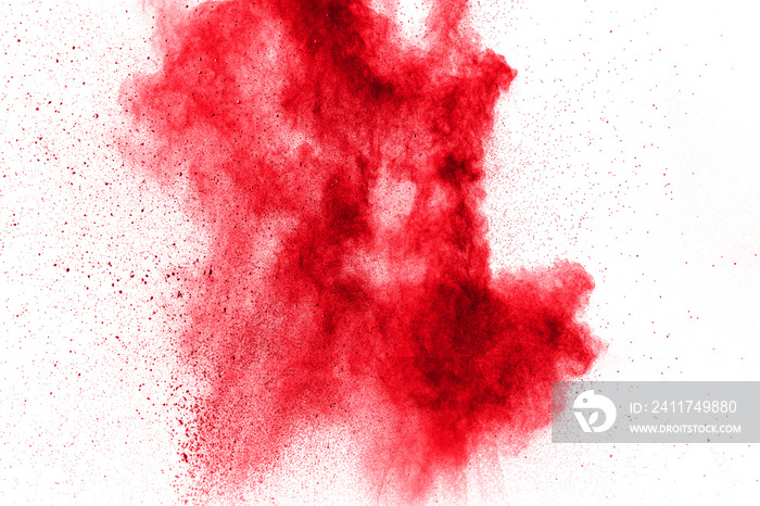 abstract red powder explosion on  white background. abstract red dust splattered on background. Freeze motion of red powder splashing.