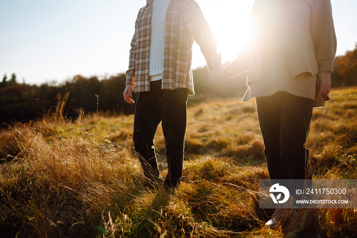 Stylish couple walking and enjoying autumn weather. People, lifestyle, relaxation and vacations concept. Autumn Fashion, style concept.