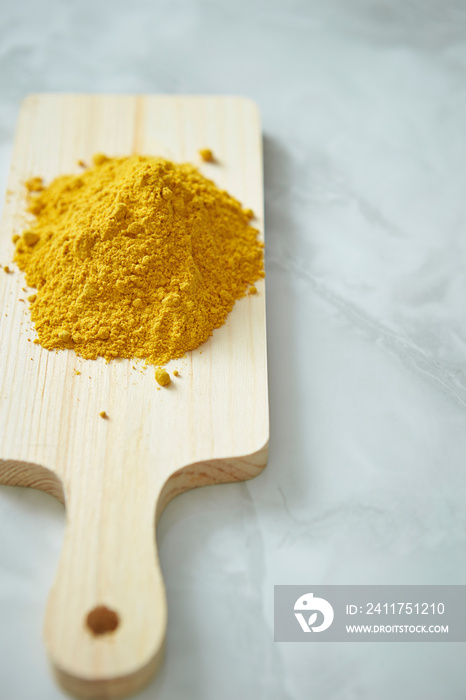 yellow powder on a cutting board