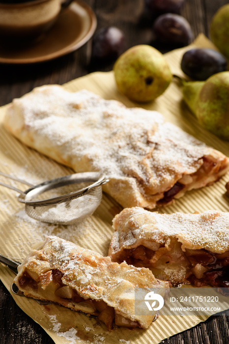 Strudel with pear, plums and cinnamon.