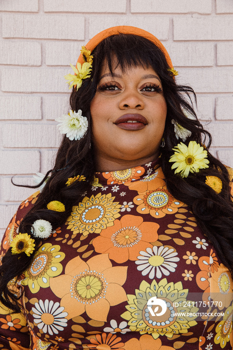closeup of plus size Black woman with flowers in hair