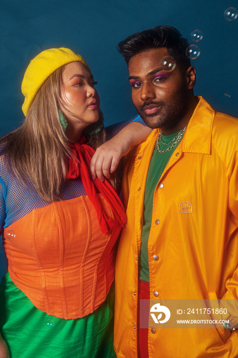 Asian duo fashion colour-blocked studio portrait