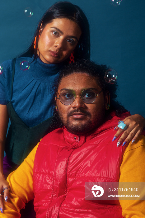 Asian duo fashion colour-blocked studio portrait