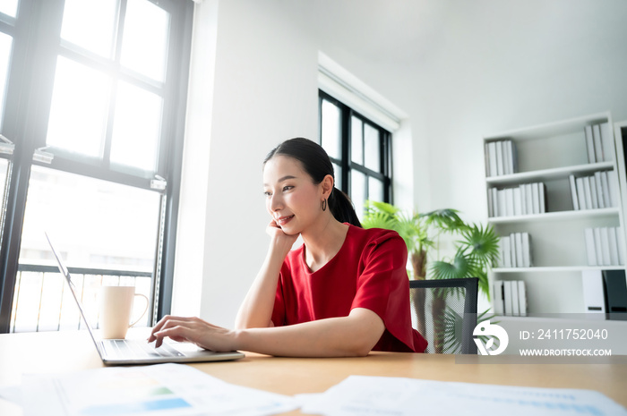 Work at home, Video conference, Online meeting video call, Portrait of beautiful young asian woman looking at computer screen watching webinar and working on laptop in workplace