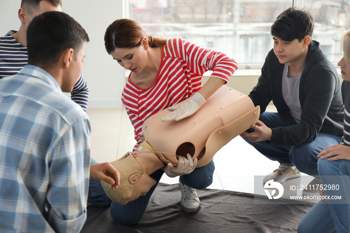 People learning to provide first aid at training course