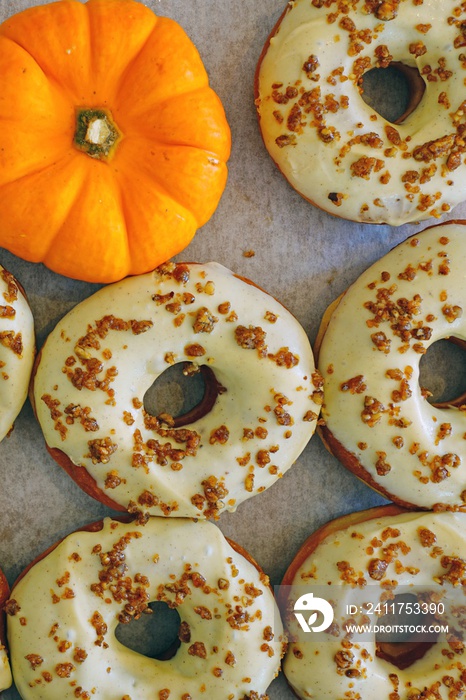 Fresh pumpkin donuts with white icing