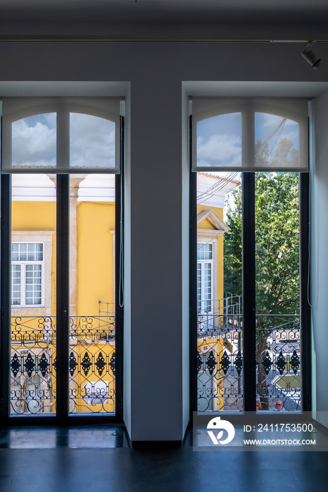 Tall windows in a empty room with plenty of light