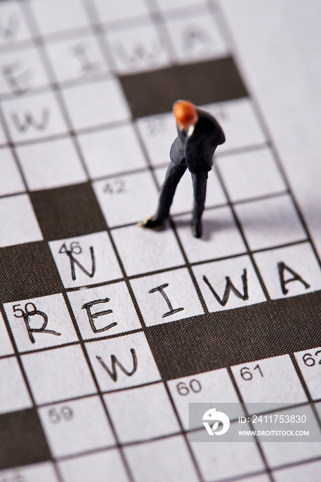 Word New and Reiwa (Japanese era name) on crossword with miniature man