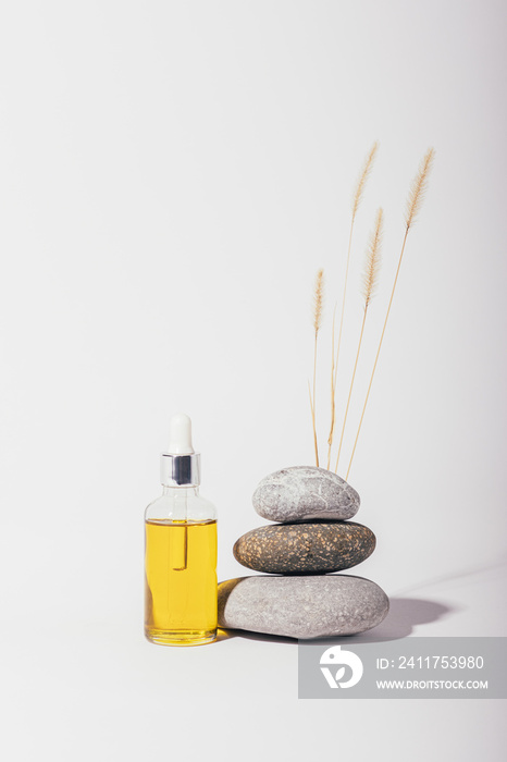 Spa composition with bottle of organic cosmetic oil