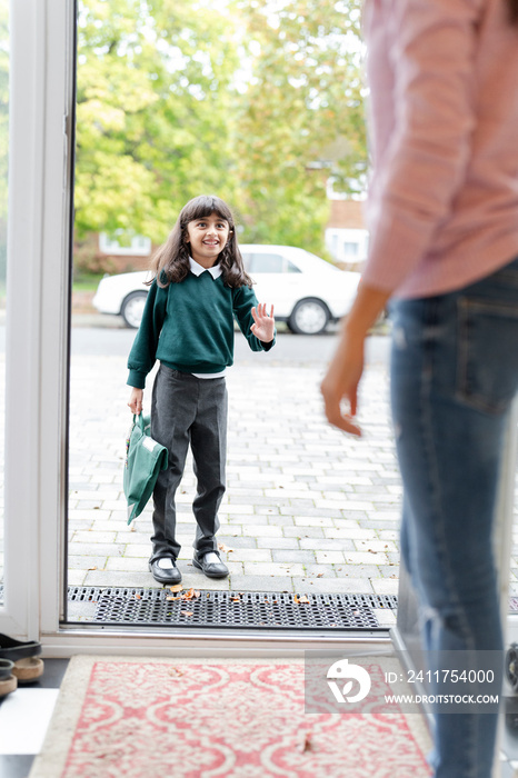 Little girl leaving home to school
