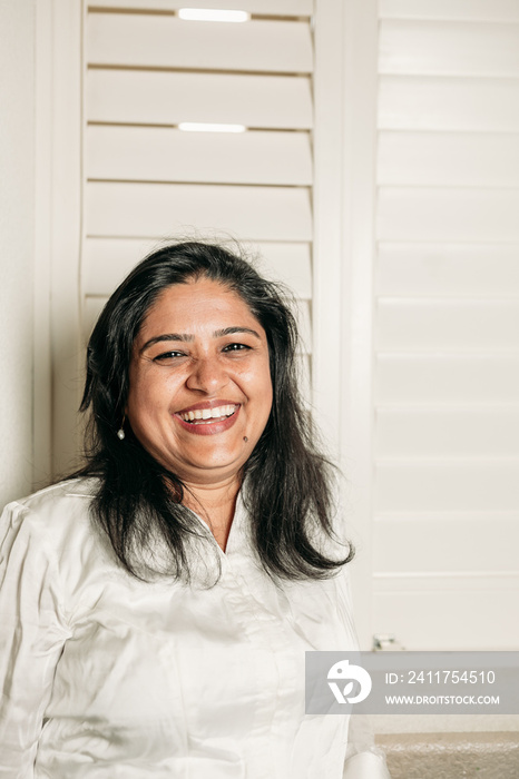 South Asian couple cooking in the Kitchen