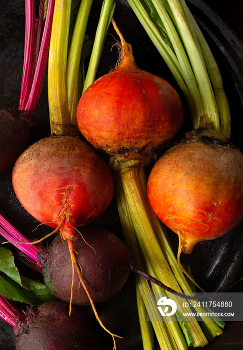 Overhead close-up of fresh yellow and red raw beets