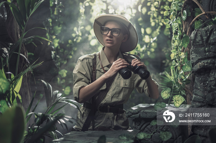 Brave woman exploring the tropical jungle