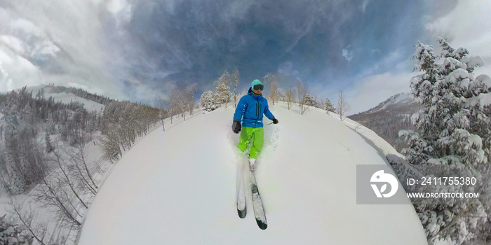 SELFIE: Male tourist on winter vacation goes tree skiing in backcountry of Utah