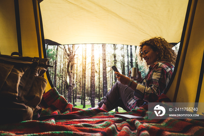 Happy free travel woman nature park camping tent lifestyle cheerful female people enjoy morning wake up outside the tent with freedom and independence - empowerment lady lifestyle